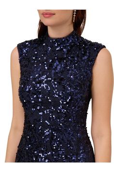 There is no shortage of beautiful details in this sparkling midi dress. This sheath dress features an extended shoulder sleeve, a mock neckline, and a midi-length skirt. Fully lined and crafted from a novelty lace, this cocktail dress is hand-embellished with sequins and has no waist seam for a comfortable fit. A zipper at the center of the back completes this design. Paired with nude high heels and a satin handbag, this sequin dress is a classy look. Extended Shoulder Sleeve, Satin Handbag, Leather Jacket Dress, Mother Of The Bride Dresses Long, Dresses Sequin, Nude High Heels, Long Sleeve Evening Dresses, Floral Shirt Dress, Lace Sheath Dress