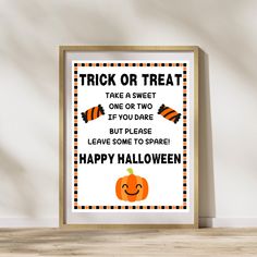 a trick or treat poster is displayed on the wall in front of a wooden frame