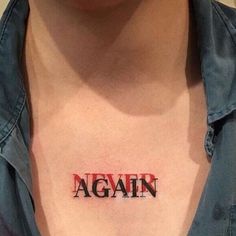 a woman with a tattoo on her chest that reads, againn in red letters