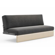 a black and white couch sitting on top of a wooden frame