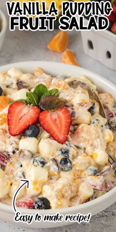 a white bowl filled with fruit salad and topped with a strawberry on the side, along with text that reads vanilla pudding fruit salad easy to make recipe