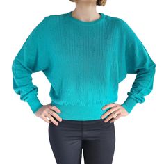 This womens vintage sweater from the 1960s exemplifies the Mod fashion of the time. Styled as a cropped long-sleeve top crafted in cotton, it pairs seamlessly with both jeans and skirts. The stunning turquoise blue shade is captivating and fashion-forward, making it an excellent addition to your mid-season retro vintage collection.   Size 10 Model -  Pullover -  Batwing Sleeves -  Crew Neck -  Snug Cuffs and Hip Band BRAND/LABEL:  Slade SIZE:  10 MEASUREMENTS:  Underarm/Bust/Chest: 64cm (please Pull Vintage, Turquoise Sweater, Cropped Long Sleeve Top, Size 10 Models, Retro Mode, Brand Label, Sweater Jumper, Mod Fashion, Vintage Sweater