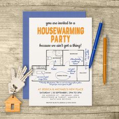 a blue and white housewarming party card with keys on it next to a pen