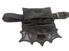 Black bat wing belt bag, fanny pack. You can wear it as an waist bag, hip bag or crossbody. The bag is vegan. Unusual belt bag is made of high-quality vegan faux leather that looks like real leather. Bat wing waist bag is for those who like different and unusual things. Goth alternative style waist bag. Perfect for everyday use, travels, festivals, night out, concerts, bike, dog walking, hiking... The length of the strap can be adjusted depending on your needs. You can adjust it perfectly to fit Black Belted Bag For Festival, Bat Belt, Gothic Belt, Goth Purse, Alternative Style, Utility Belt, Bat Wing, Unusual Things, Festival Bag