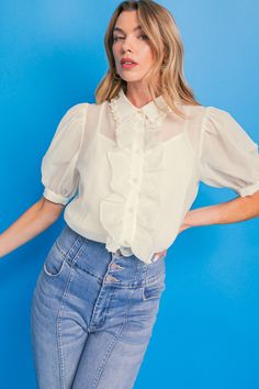 This EASY ESSENTIAL IVORY WOVEN TOP is a timeless and stylish choice. It features a solid woven fabric, pearl embellishment trim along the shirt collar, button down with ruffles, and short sleeves. This top is perfect for any occasion, from casual to semi-formal events. DetailsSelf : 100% PolyesterLining : 100% Polyester Size & Fit- Model is 5`8" And Wearing Size Small- Measurements Taken From Size Small- Approx. Length: 25" Pearl Embellishment, Embellished Collar, Flying Tomato, Woven Top, Vintage Inspired Design, Formal Looks, Ivory Color, Shirt Collar, Semi Formal