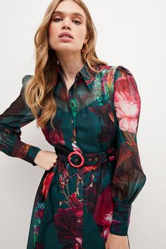 Summertime Opulence Comes Guaranteed With This Ladylike Organdie Dress. Defined By Its Bold Blooms, Puffed Shoulders And Retro Circular-Clasped Belt, It Makes An Elegant Choice For Summer Garden Parties. Buttoned From Top To Bottom And Finished With A Pointed Collar, This Long-Sleeved Design Ticks All The Right Style Boxes.