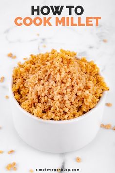 a white bowl filled with brown rice on top of a marble counter