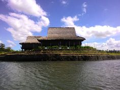 a house on an island in the middle of water