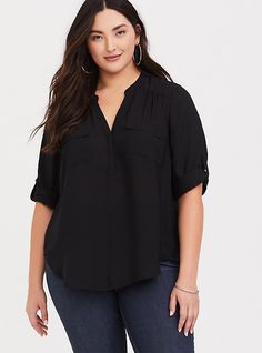 A split neck and tab sleeves lend polish to a smooth georgette blouse that has graceful movement and versatile styling appeal. Georgette fabric. Split neck. Hidden button placket. 3/4 length tab sleeves. Chest pockets. Shirttail hem. CONTENT + CARE: Polyester. Wash cold; dry flat. Imported plus size tops. SIZE + FIT: Model is 5'11”, size 1. Size 2 measure 32” from shoulder. The best plus size women's harper - black georgette pullover blouse the in deep black made of georgette. These dressy cloth Georgette Blouse, Georgette Fabric, Deep Black, Work Wardrobe, Long Sleeve Tunic, Plus Size Blouses, Plus Size Tops, Black Blouse, Best Seller