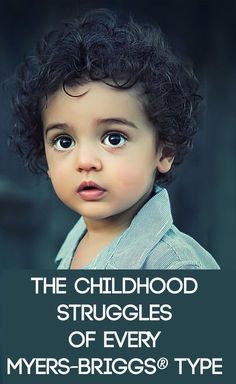 a little boy with curly hair looking at the camera