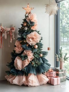 a christmas tree with pink and green decorations