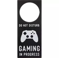 a door hanger with a video game controller on it's front and the words, do not disturb gaming in progress