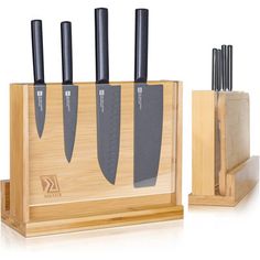 a set of knives in a wooden holder