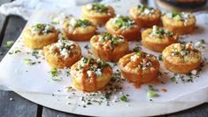 there are many small pastries on the plate with sprinkles and seasoning