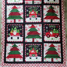 a christmas quilt with cars and trees on it