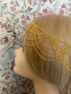 ♥ Six Feathers Studio♥ Art Deco style flapper headband made of goldtone metal chains. Many beautiful drapes through front and sides. Adjustable chain with two lobster clasps in back. Statement piece! Great for a wedding, art deco party, Downton Abbey, Gatsby, or 20s style event! :) I ship both US and International. This unique item is being sold as is with no returns and no exchanges so look at the pictures and ask questions before you bid. I am available to answer any questions and do get back Elegant Gold Body Jewelry For Festivals, Gold Metal Body Jewelry For Festival, Adjustable Gold Hair Accessories For Festivals, Gold Bohemian Crown Headpiece, Bohemian Gold Crown Headpiece, Gold Crown Headpieces For Festival, Bohemian Gold Headpiece For Party, Gold Gatsby Headpiece For Party, Gold Headband For Party