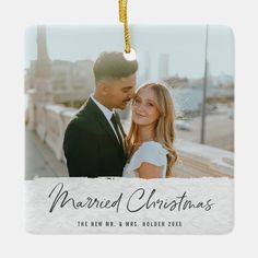 a christmas ornament with a photo of a couple