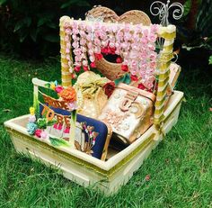 a basket filled with lots of items sitting in the grass