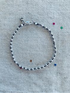 This listing is for one sterling silver round bead bracelet on knotted grey silk cord with a Swarovski crystal charm.  Bead size = 2.5 mm  Bracelet lengths = Please choose 6, 6.5, 7, or 7.5 inches in the drop down menu. 6.5- 7 are the most popular sizes. If you're unsure - measure your wrist and then add 1/2 inch if you want it to be somewhat fitted or 1 inch if you want a looser fit.  Each bracelet is custom made by hand, with love. Silk Cord Bracelet, Silk Cord, Cord Bracelet, Jewelry Card, Silver Bead, Crystal Charm, Cord Bracelets, Bracelet Silver, Everyday Jewelry