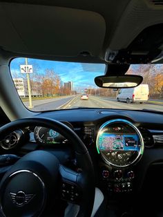 the dashboard of a car on a highway