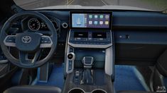 the interior of a car with dashboard, steering wheel and touchscreens on display