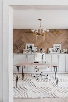 a dining room with white walls and wood paneling