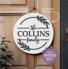 a wooden door with a sign that says the collin's family on it and an image of a giraffe