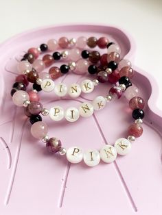 Are you going to P!NK's Summer Carnival Australian tour? Commemorate her concert experience with this luxe friendship bracelet, featuring: * mother of pearl letters * pink tourmaline * rhodonite * smoky quartz * rose quartz * strawberry quartz * black agate, and * your choice of precious metal beads. These are made to order, with an approximate dispatch time of 1-2 weeks. PERSONALISATION Add extra meaning and uniqueness to your jewels with a 14k gold filled or sterling silver charm! These are hand stamped with an uppercase initial or symbol of your choosing (only one per charm). You can purchase charms by adding them to your cart separately: https://www.etsy.com/au/listing/898692437/hand-stamped-charms-14k-gold-filled SIZING Bracelets are generally made to 7 inches (17.8cm), however refer Personalized Pink Spiritual Bracelets, Personalized Pink Spiritual Bracelet, Spiritual Personalized Pink Bracelets, Spiritual Pink Personalized Bracelets, Spiritual Personalized Pink Bracelet, Pink Beaded Bracelets With Natural Stones For Friendship, Pink Natural Stone Bracelets For Friendship, Pink Natural Stones Bracelet For Friendship, Pink Rose Quartz Bracelet For Friendship