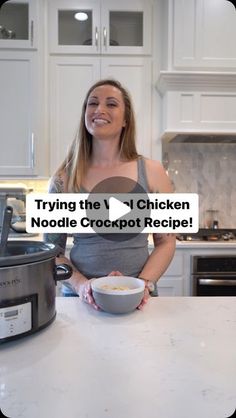 a woman standing in front of an open crockpot with the words trying the v1 chicken noodle crockpot recipe