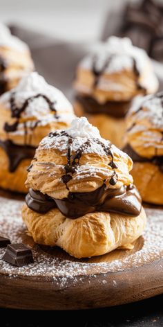 chocolate covered pastry sitting on top of a wooden board