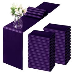 purple table runners and vases with flowers on them are ready to be used as centerpieces