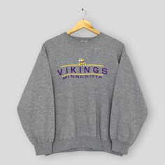 Vintage Minnesota Vikings NFL Sweatshirts Small Minnesota Vikings Embroidery Spell Out Sweater Vikings American Football Crewneck Size S Good Used Condition. No holes and stains. Size (On Tag) : Size S **To make sure if it FITS YOU, refer at the exact measurements. Size Measurement (All measurements were taken lying flat) : Width [armpit to armpit] : 21 inches / 53 cm Length [shoulder to end of garment] : 24 inches / 64 cm THIS IS USED CLOTHING! PLEASE DON`T EXPECTED IT TO BE LIKE NEW OR DON`T E Vintage Minnesota Vikings, Vikings Game Day Outfit, Fan Apparel Crew Neck Tops With Embroidered Graphics, Crew Neck Top With Embroidered Logo For College, Fan Apparel Top With Embroidered Graphics, Embroidered Long Sleeve Tops For College, Vintage Crew Sweatshirt With Embroidery, Winter Fan Apparel Tops With Embroidered Logo, Vintage Embroidered Crew Sweatshirt