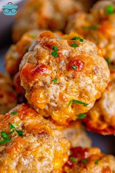 some meatballs are stacked on top of each other with parsley in the middle