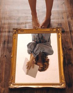 a person standing in front of a mirror with their feet on the floor