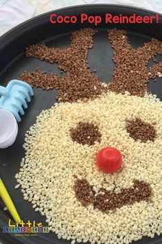 a tray with rice and cereal in the shape of a reindeer's head on it