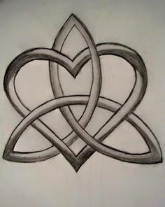 a drawing of two intertwined hearts on a white wall