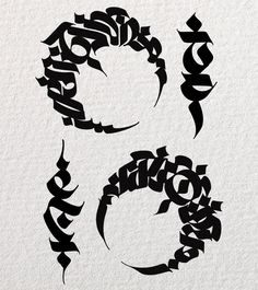 some type of calligraphy that is black and white with the letters written in it