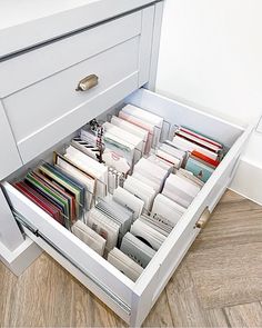 an open drawer with many files in it