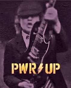 a man in a suit and tie holding a guitar with the words pwr up on it