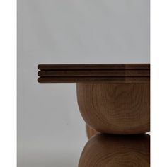 a close up of a wooden object on a table