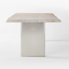 a white table with a square wooden top