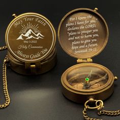 a gold compass with a bible verse on it sitting next to a chain that says, may your faith be made here