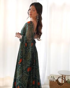 Introducing our stunning green bandhani printed chiffon mehendi wear gown, crafted with intricate bandhani print work that adds a touch of elegance to your ethnic wardrobe. This beautiful gown comes with a matching chiffon dupatta adorned with bandhani print work and fancy lace border, making it the perfect ensemble for festivals, functions, and events.
This gorgeous outfit include an 8-meter gown flair and a 2.3-meter long dupatta, providing you with ample fabric to create a stunning draping lo Festive Bohemian Georgette Maxi Dress, Bollywood Style Saree Maxi Dress In Georgette, Bohemian Floor-length Georgette Maxi Dress, Flowy Green Georgette Dress, Georgette Bandhani Print Dresses For Party, Bohemian Green Georgette Anarkali Set, Green Georgette Dress With Chikankari Embroidery, Bohemian Georgette Dress For Navratri, Georgette Maxi Dress With Dupatta