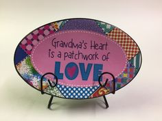 a decorative plate with the words grandma's heart is a patchwork of love