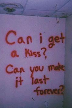 graffiti written on the wall in a bathroom stall, which reads can i get a kiss? can you make it last forever?