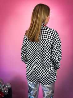 Be bold in this No Rules Checkered Print Shacket! This unique button-front layering piece adds a playful twist to your look, with a relaxed fit and double-knit fabric to keep you cozy. Perfect for staking up your style game! No rules here. -Double knit fabric and super soft! Feels like a jersey knit! -All over checkered print pattern of black + heathered gray combo -Relaxed fit with button front -Oversized, chest pockets -Great for layering in the colder months! -100% Polyester Sizing: The shack Retro Button-up Top For Winter, Retro Long Sleeve Tops With Snap Buttons, The Shack, Metallic Pants, No Rules, Checkered Print, Checker Print, Fringe Jacket, Double Knit