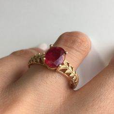 RING DETAILS: ✪Design: Gold ring ✪Gemstone: Ruby ✪Gemstone shape: Oval ✪Gemstone transparency: Transparent ✪Gemstone size: 7mm*9mm ✪Gemstone weight: 2.60 cts. ✪Setting type: Prong setting ✪Metal type: 14k yellow gold ✪Metal finish: Smooth shiny Choose your ring size from drop down menu and if you need any other preferred ring size please contact us. QUALITY OF MATERIALS: Metal: Most of our jewelry at JewelryMansion is made with precious metals like gold and silver. These metals are 100% non-alle Ruby Ring With Diamond Cut For Promise, Ruby Promise Ring With Diamond Cut, Heirloom Ruby Ring With Accent Stones In Yellow Gold, Heirloom Style Lab-created Ruby Ring Gift, 14k Yellow Gold Ruby Ring With Accent Stones, Ruby Ring With Diamond Cut For Gift, Ruby Ring With Diamond Cut As Gift, Diamond Cut Ruby Ring As A Gift, Gold Ruby Ring With Accent Stones