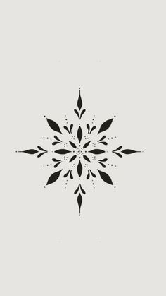 a black and white snowflake on a gray background