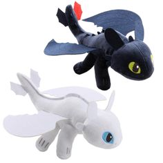 two stuffed animals that look like toothbrushes and toothpaste dragon tails, one is black and the other is white