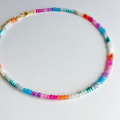 The Mila Necklace - 15” beaded necklace with 3” gold plated extender. - Made with multi colored, faceted rondelle beads. - Available in other colors as seen in the last photo! - Beads are dyed, so water contact will dull the colors over time. Keep dry for long lasting color pop! FREE shipping when you spend $40 or more! Colorful Faceted Round Bead Necklaces, Colorful Necklaces With Faceted Round Beads, Adjustable Rainbow Faceted Beads Necklace, Rainbow Faceted Round Bead Necklaces, Adjustable Rondelle Necklaces With Colorful Beads, Rainbow Heishi Beads Necklace With Spacer Beads, Rainbow Faceted Round Beaded Necklaces, Rainbow Faceted Round Beads Necklace, Rainbow Faceted Round Beaded Necklace